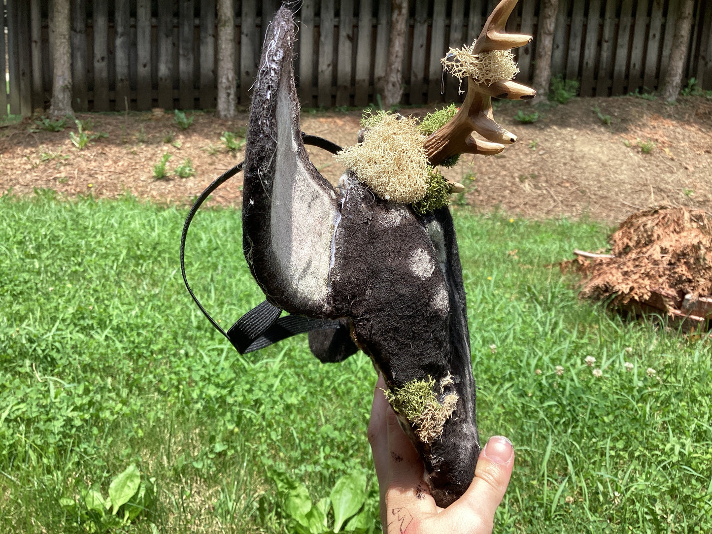 Axis deer therian mask with moss on it