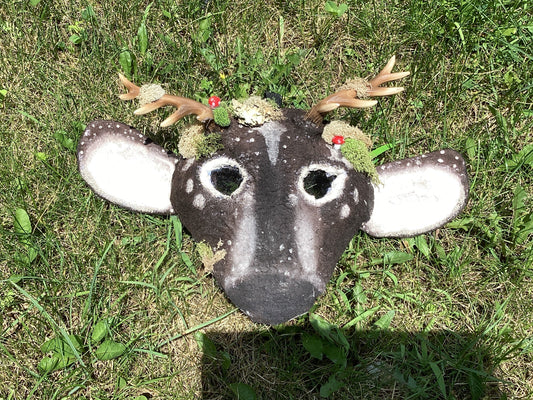 Axis deer therian mask with moss on it